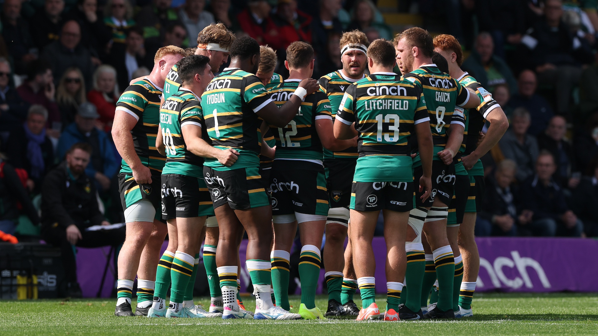 Northampton Saints players huddle together