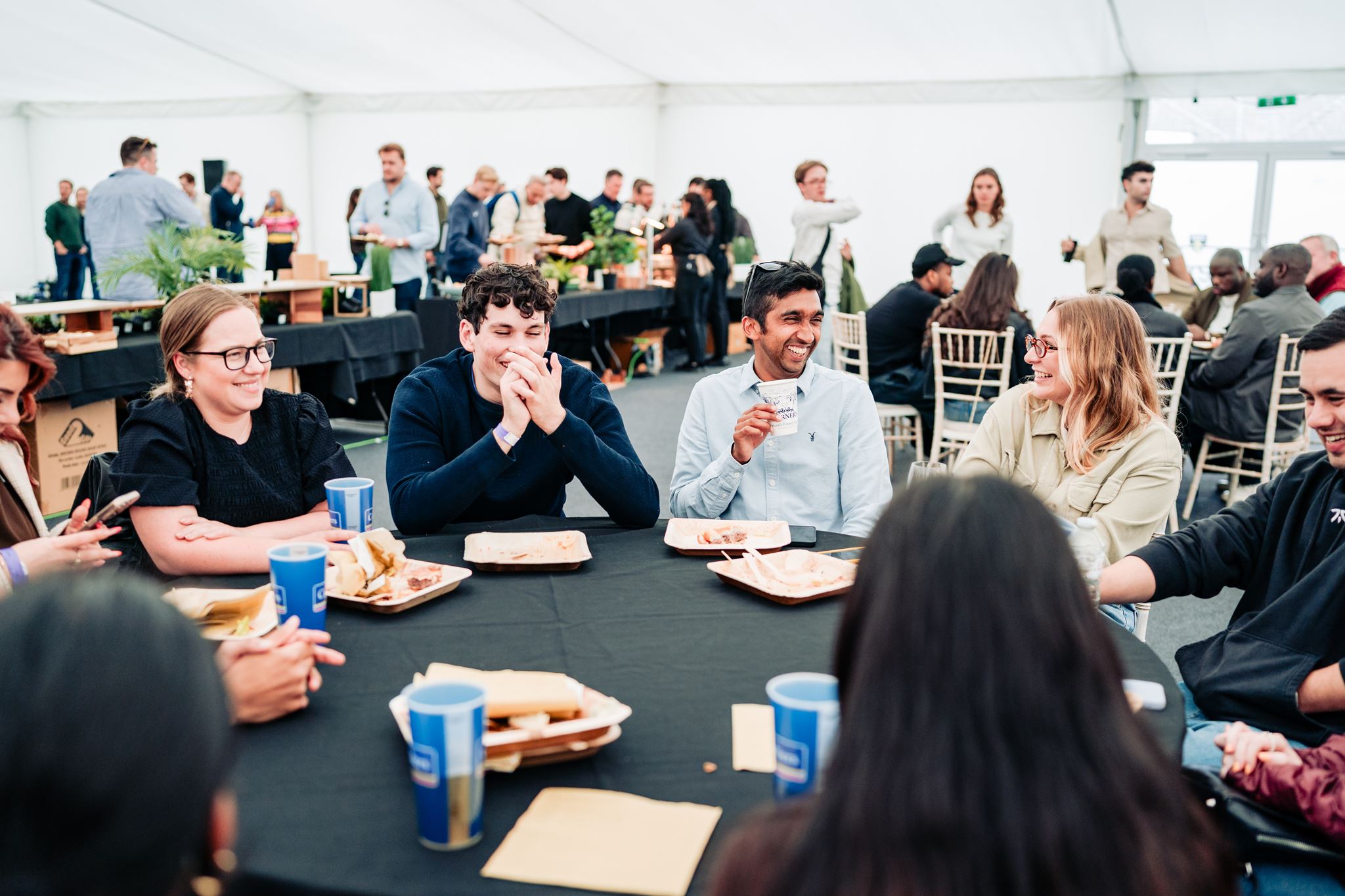 People eating at event at Franklin's Gardens