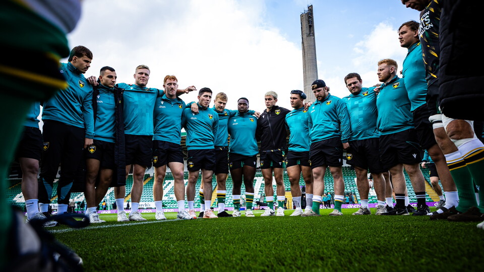 Northampton Saints players huddle together