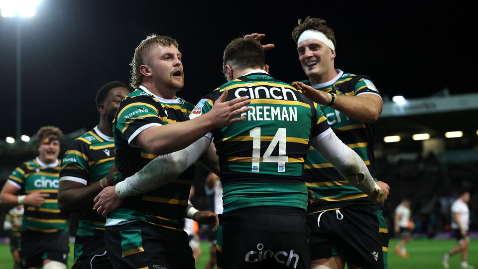 Northampton Saints celebrate scoring a try