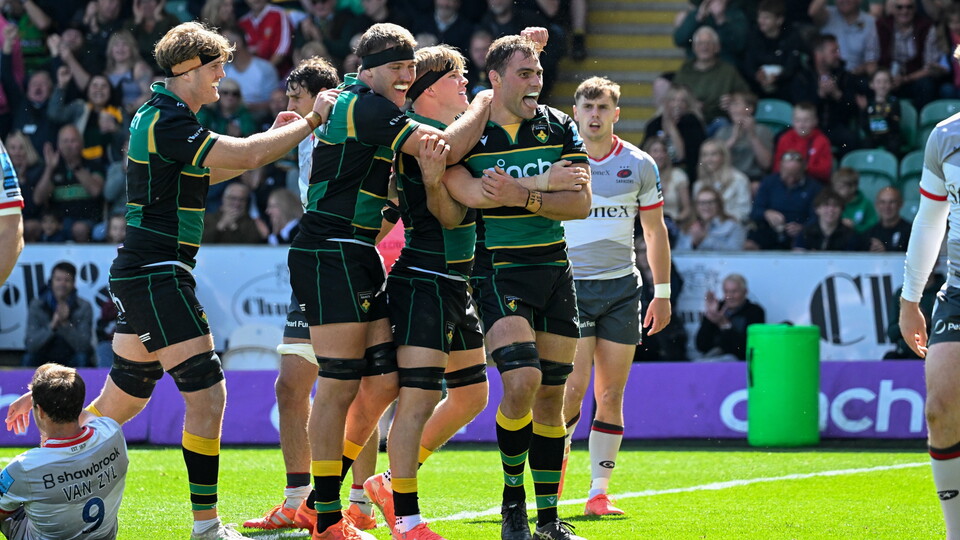 Northampton Saints celebrate scoring a try