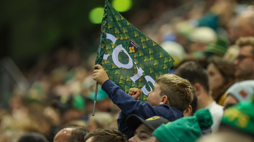 A Saints fan celebrates a try